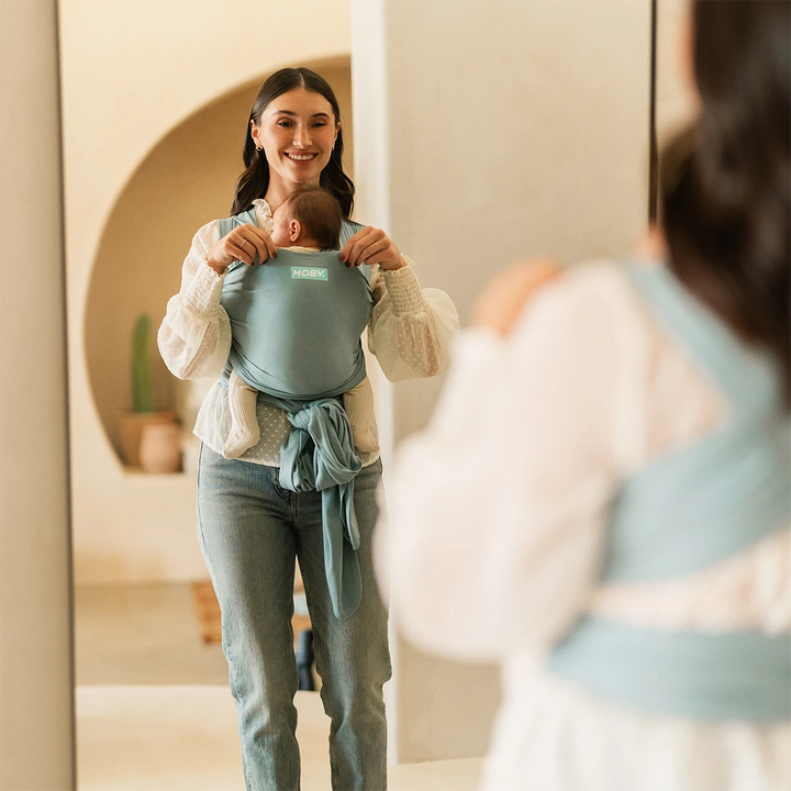 mom wearing baby in MOBY Wrap Evolution in Sea Glass