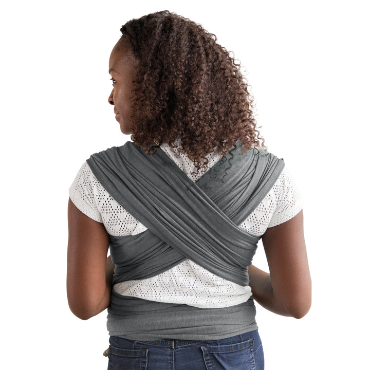 back image of mom wearing baby in elements wrap in asphalt