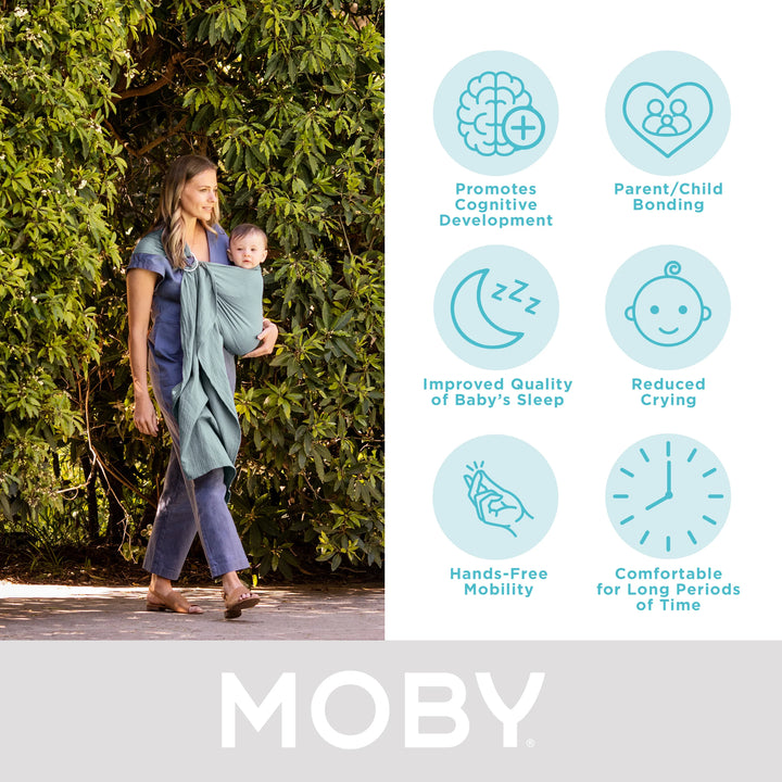 mom wearing baby in moby ring sling. promotes cognitive development, parent/child bonding, improved quality of baby's sleep, reduced crying, hands-free mobility, comfortable for long periods of time.