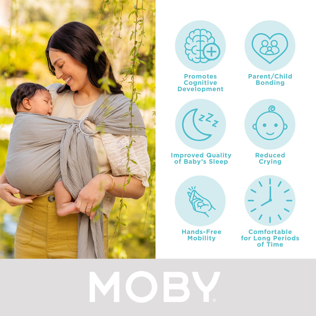 mom wearing baby in moby ring sling. promotes cognitive development, parent/child bonding, improved quality of baby's sleep, reduced crying, hands-free mobility, comfortable for long periods of time.