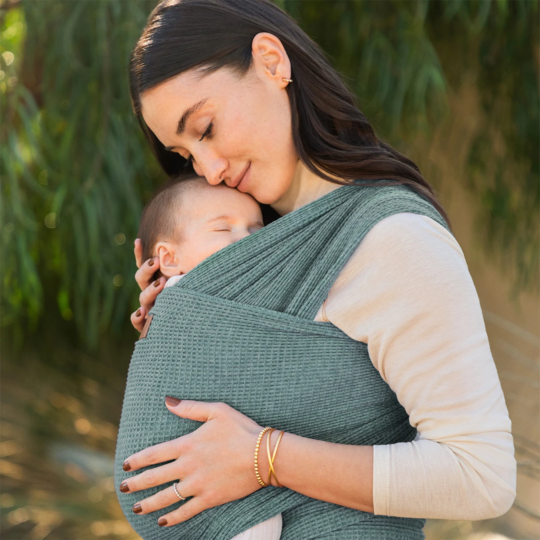 mom wearing baby in waffle knit wrap in saguaro