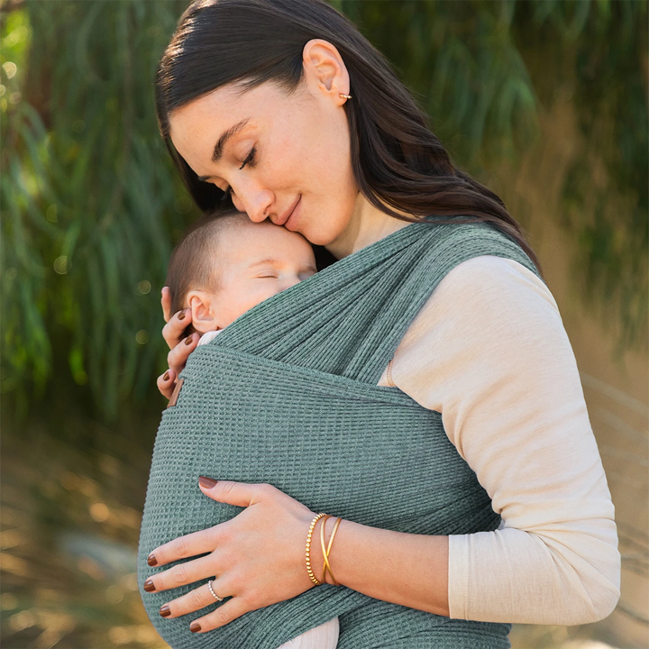 mom wearing baby in waffle knit wrap in saguaro