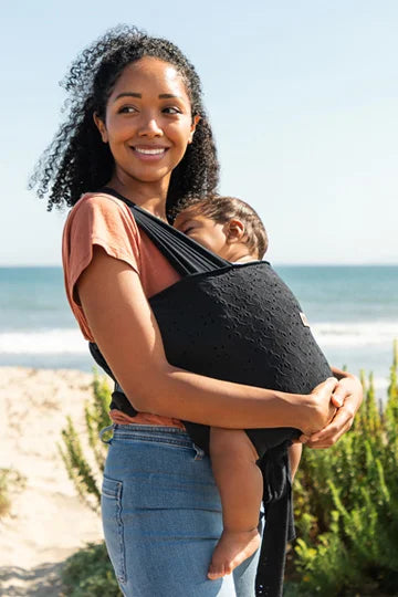 mom wearing moby easy wrap in black eyelet