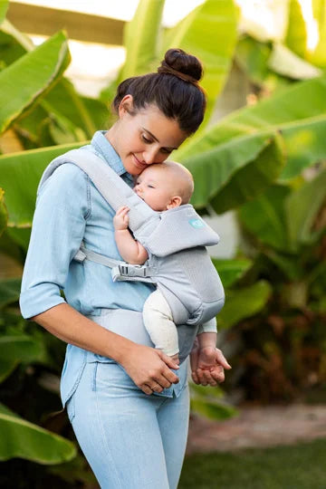 mom wearing moby baby carrier