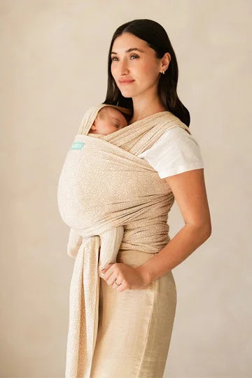 mom wearing moby classic wrap in coastal blooms
