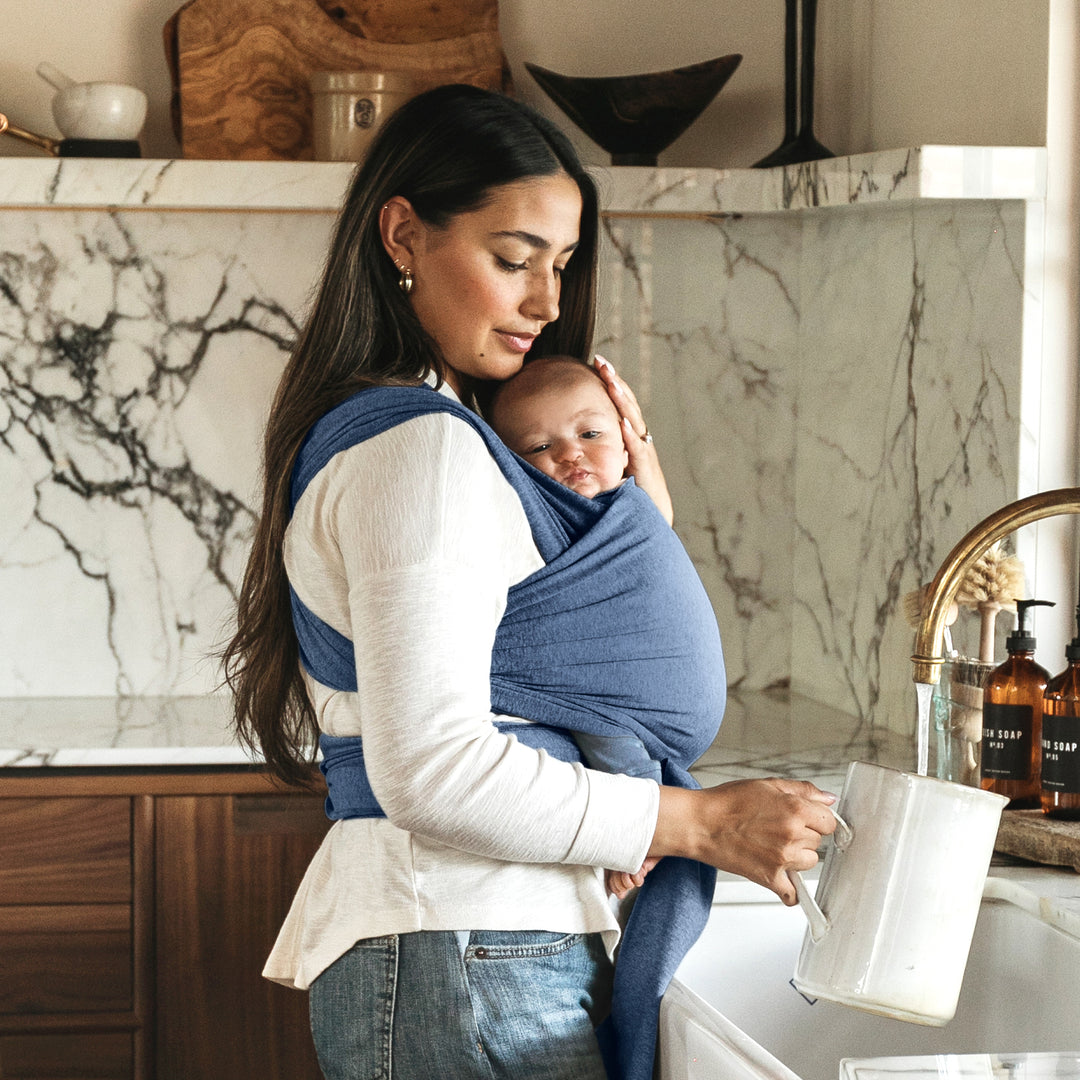 mom wearing baby in moby wrap