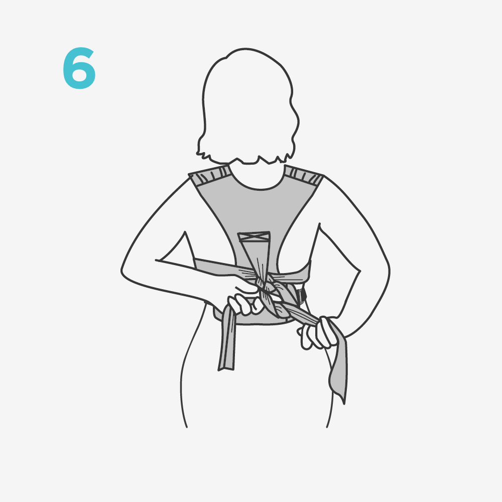 Placing the ends of your sash under the baby's legs, tie with a double knot to secure hold.​ Note: Sash can be safely tied in the front or back with a double knot.​