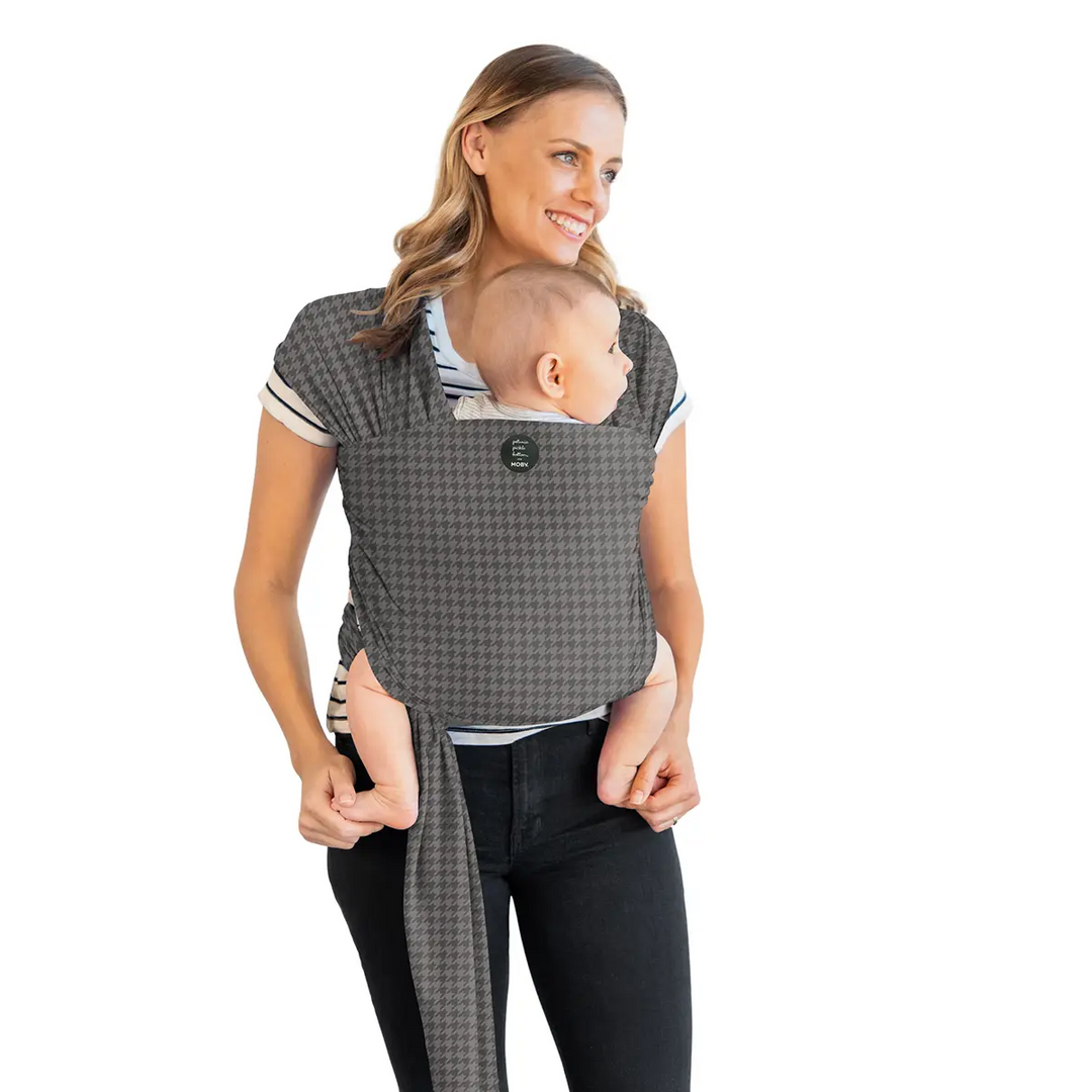 mom wearing baby in Classic Wrap Baby Carrier by Petunia Pickle Bottom in Houndstooth