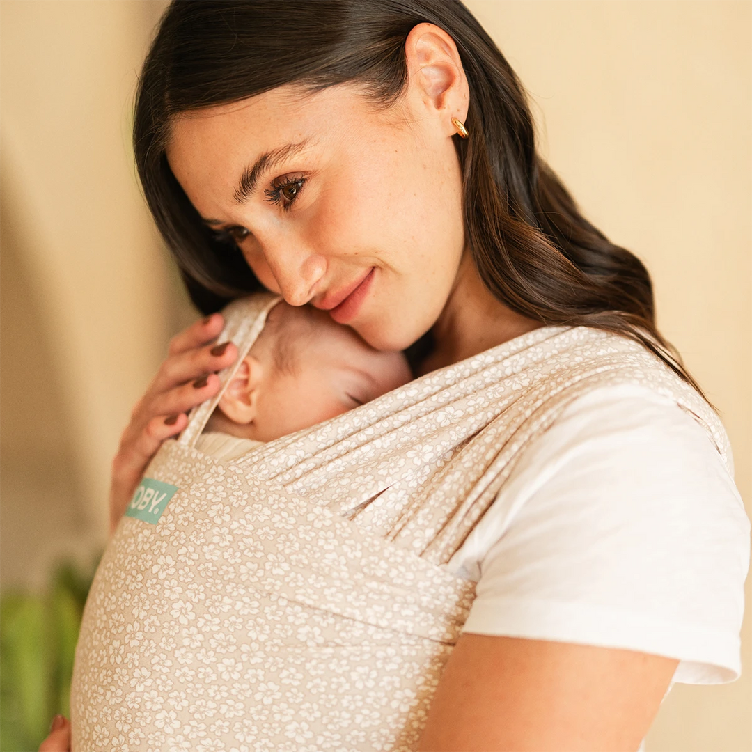 mom wearing baby in Classic Wrap Baby Carrier in Coastal Blooms