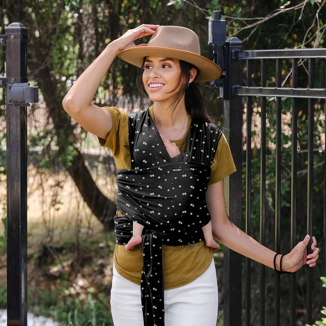 mom wearing baby in Classic Wrap Baby Carrier in Desert Daisy