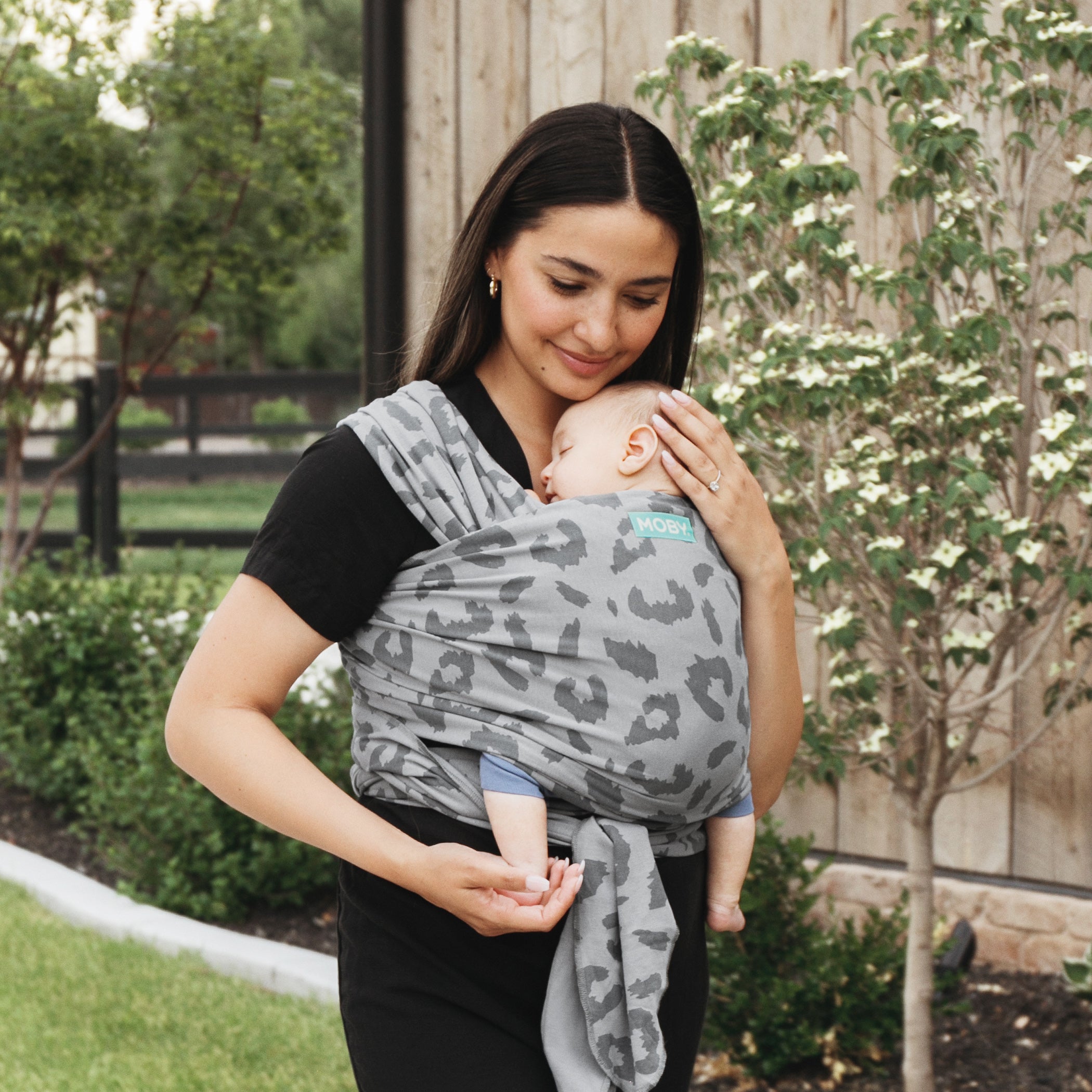 mom pictured wearing baby in 100% cotton classic moby wrap leopard print