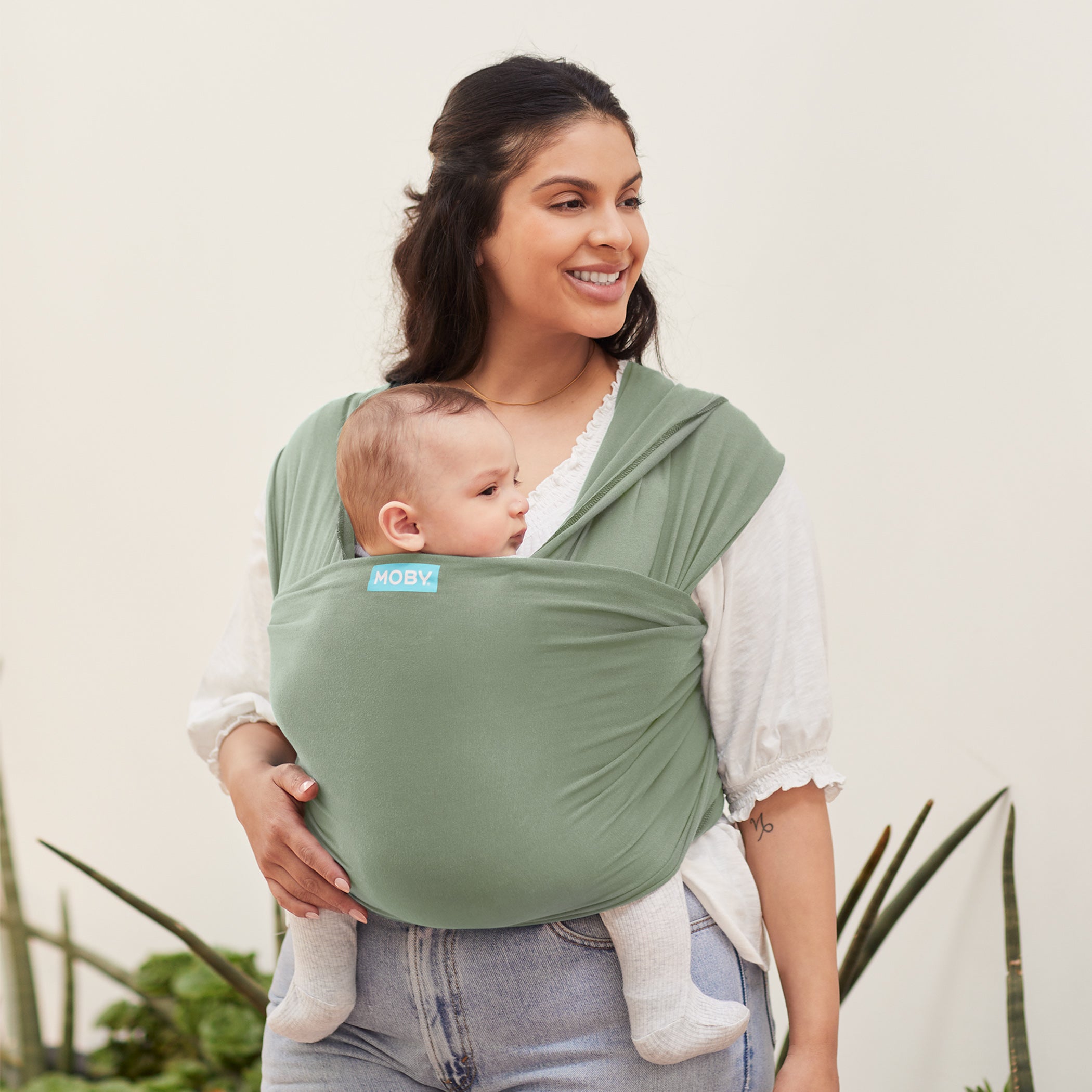 Mom wearing baby in Moby Classic Wrap Baby Carrier in Pear