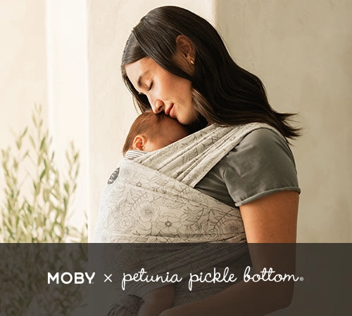 moby x petunia pickle bottom. mom wearing baby in classic wrap in seaside poppies