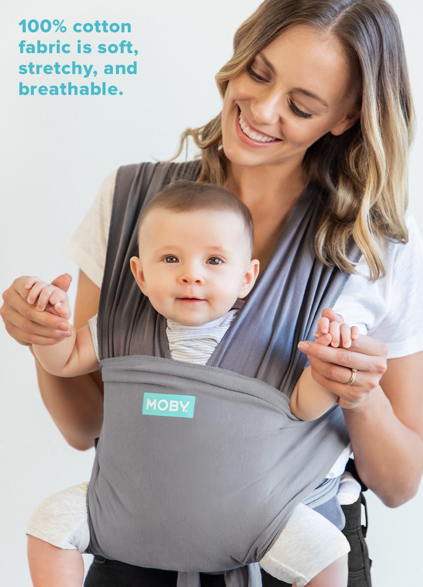 mom holding baby in gray Moby Easy-Wrap Carrier