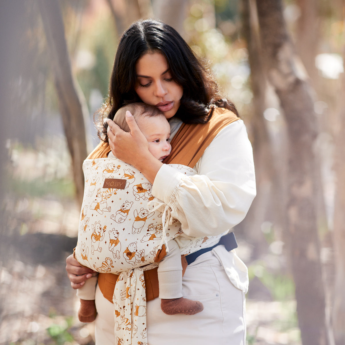 moby easy-wrap worn by mom comforting baby 