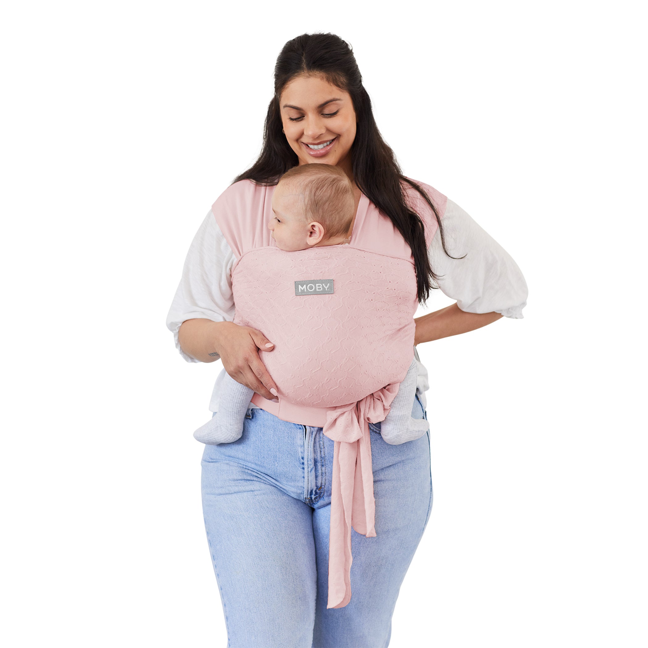 mom wearing baby in MOBY Easy Wrap Carrier by Petunia Pickle Bottom in Rose Quartz Eyelet
