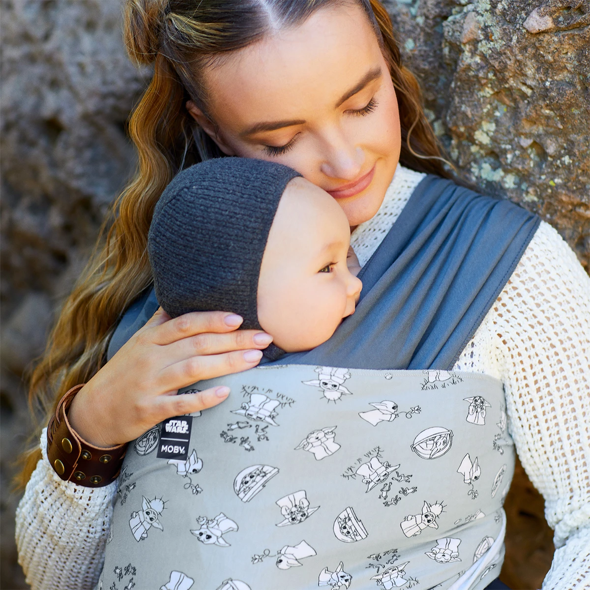 Mom wearing baby in Easy-Wrap Carrier in Grogu’s Galaxy