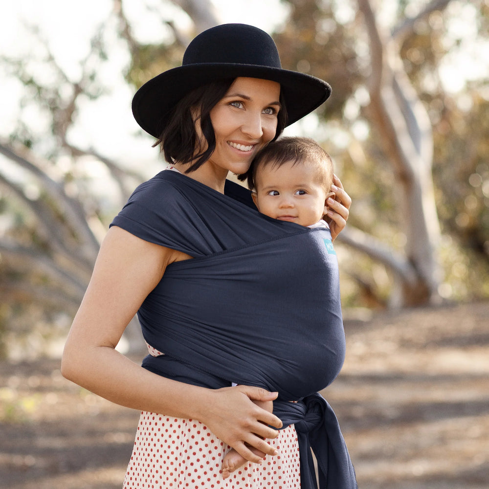 Mom wearing baby in Classic Wrap Baby Carrier in Deep Sea