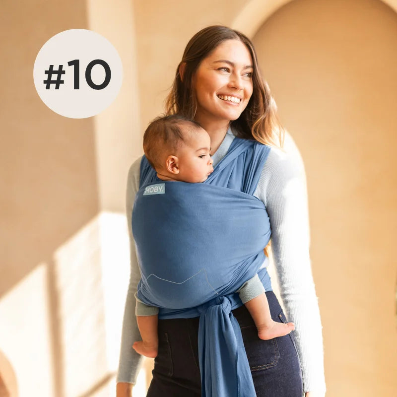 #10 mom wearing baby in classic wrap in ocean