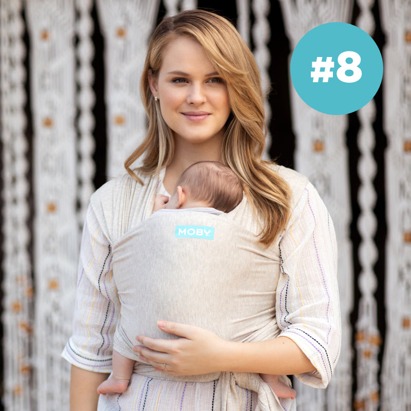 #8 Moby Best Seller. Mom wearing baby in classic wrap in almond
