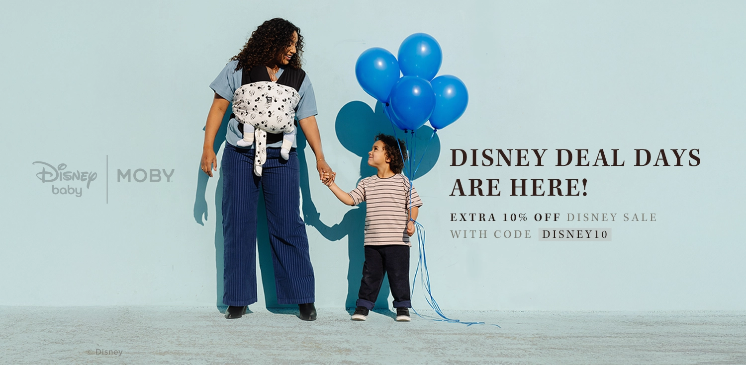 disney deal days are here! extra 10% off disney sale with code disney10. mom wearing baby in disney easy wrap