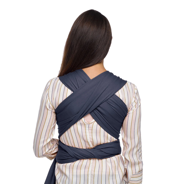 back image of Mom wearing baby in Classic Wrap Baby Carrier in Deep Sea.