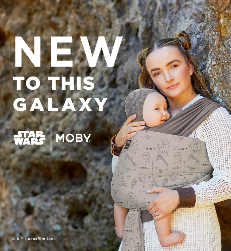 mom wearing easy-wrap carrier in star wars carrier. new to this galaxy star wars by moby.