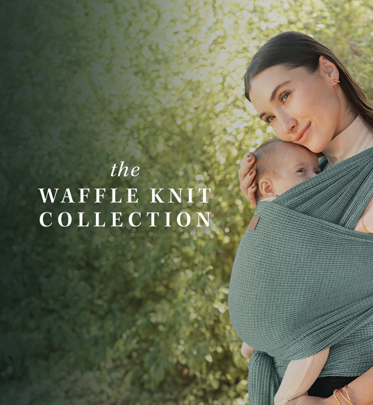 the waffle knit collection. mom wearing baby in waffle knit wrap in saguaro