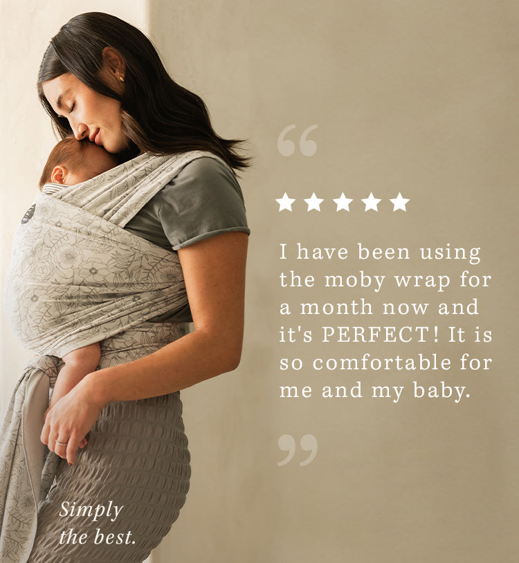 i have been using the moby wrap for a month now and it's perfect! it is so comfortable for me and my baby" simply the best. mom wearing baby in seaside poppies wrap