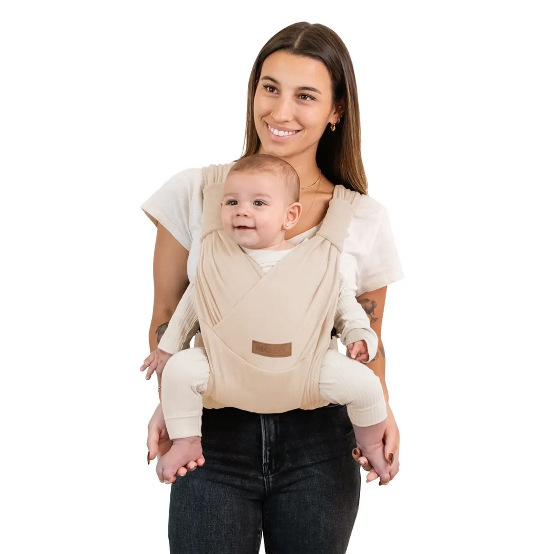 mom wearing baby in duet carrier in feather