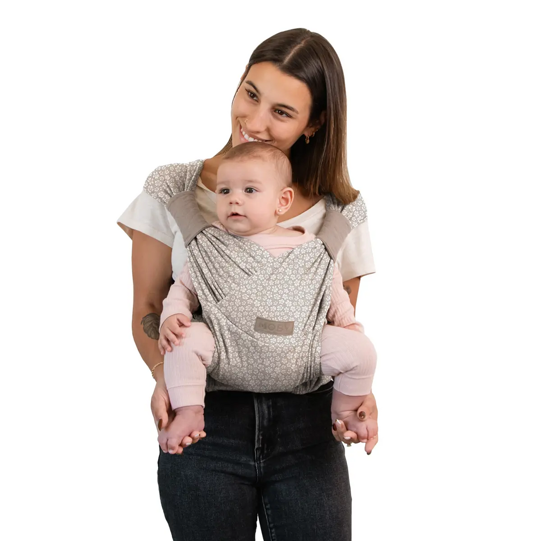 mom wearing baby in dueyt carrier in prairie blooms