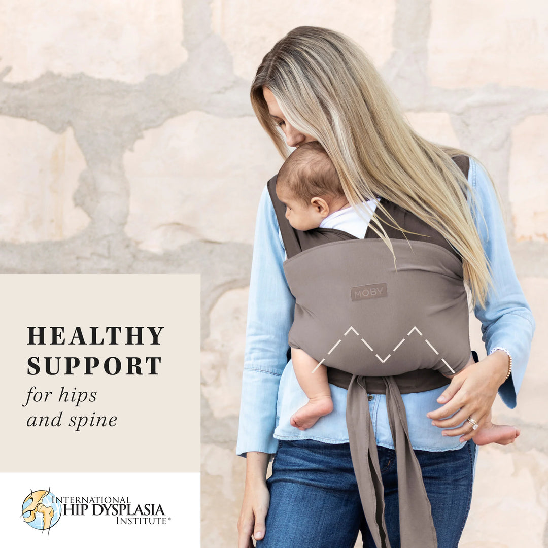 mom wearing baby in Easy-Wrap Carrier in Canyon. healthy support for hips and spine by international hip dysplasia institute