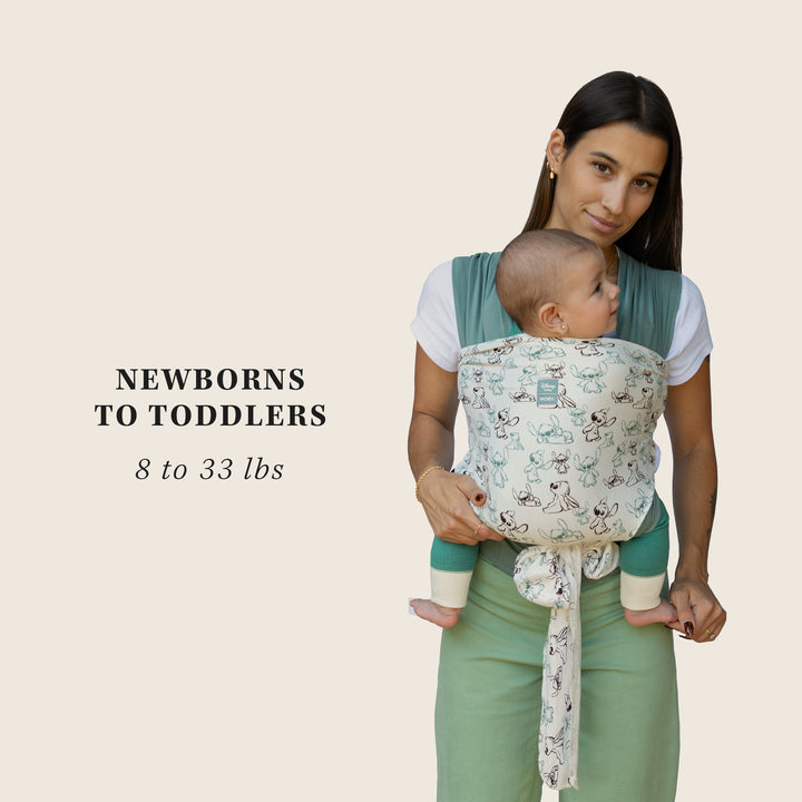 mom wearing infant in easy-wrap stitch. newborns to toddlers 8 to 33 lbs