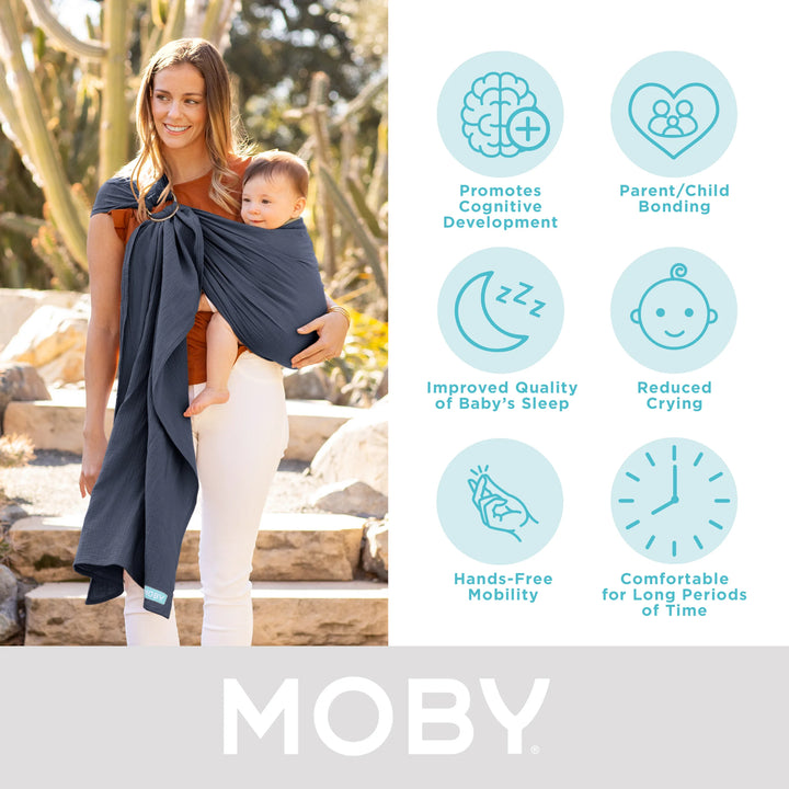 mom wearing baby in moby ring sling. promotes cognitive development, parent/child bonding, improved quality of baby's sleep, reduced crying, hands-free mobility, comfortable for long periods of time.