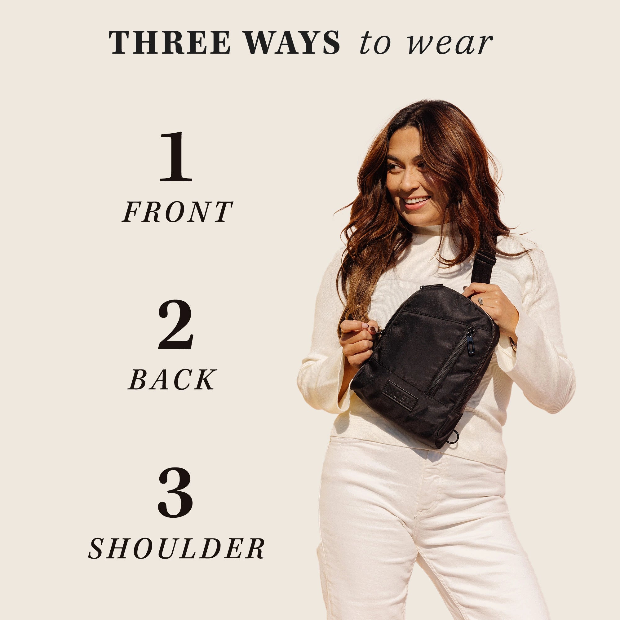three ways to wear this mini diaper bag. wear on front, back or as a shoulder bag