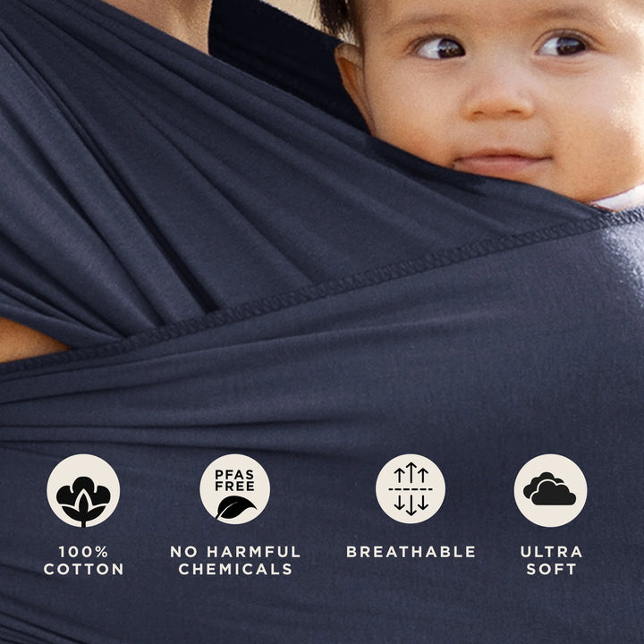 Mom wearing baby in Classic Wrap Baby Carrier in Deep Sea. 100% cotton, pfas free no harmful chemicals, breathable, ultra soft