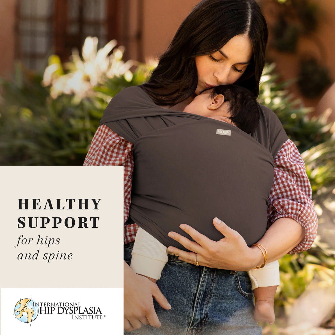 mom wearing baby in Classic Wrap Baby Carrier in Hickory. healthy support for hips and spine by international hip dysplasia institute
