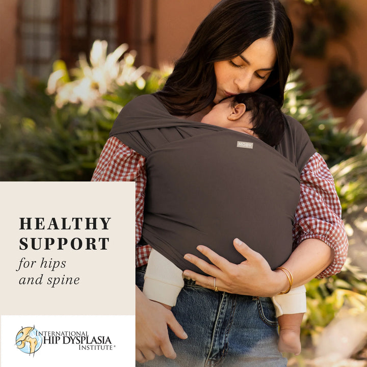 mom wearing baby in Classic Wrap Baby Carrier in Hickory. healthy support for hips and spine by international hip dysplasia institute