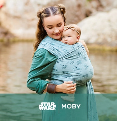star wars and moby. mom wearing baby in featherknit wrap in playful padawan