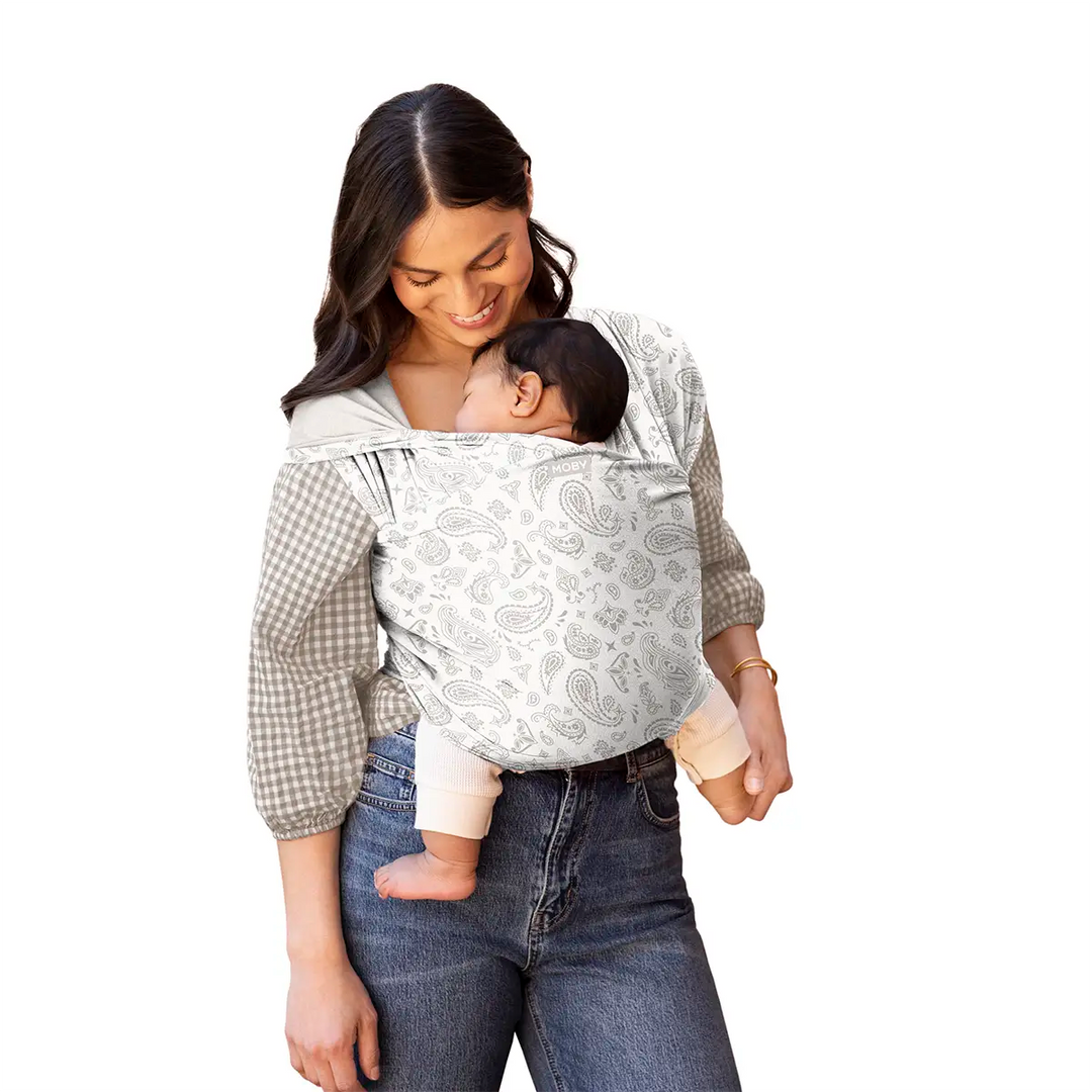 Mom wearing baby in Classic Wrap Baby Carrier in Bandana