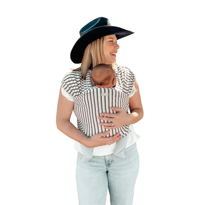 mom wearing baby in Classic Wrap Baby Carrier in Heirloom Stripe