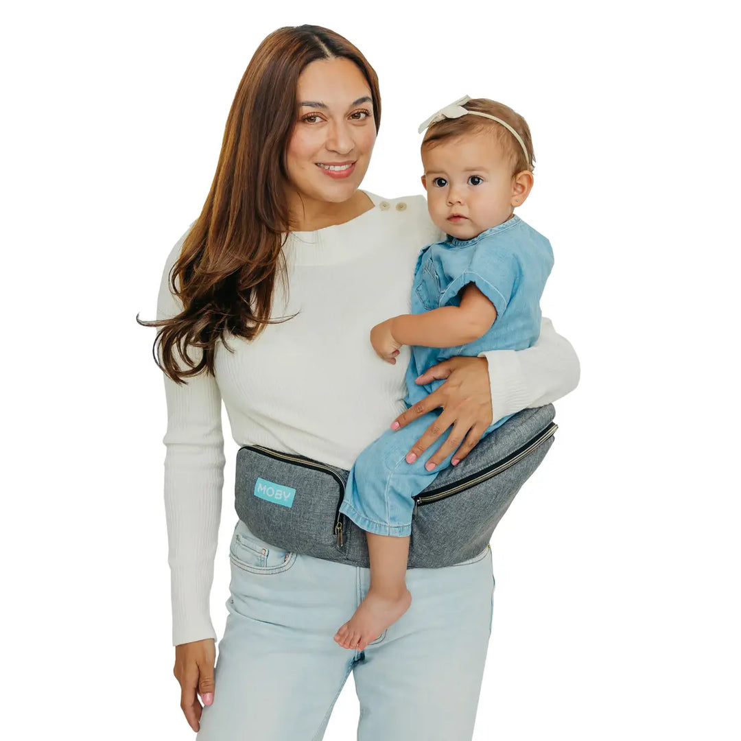 mom wearing baby in hip seat