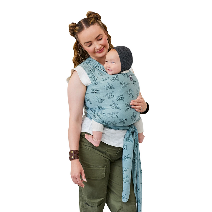 Mom wearing baby in Moby Featherknit Wrap in Playful Padawan