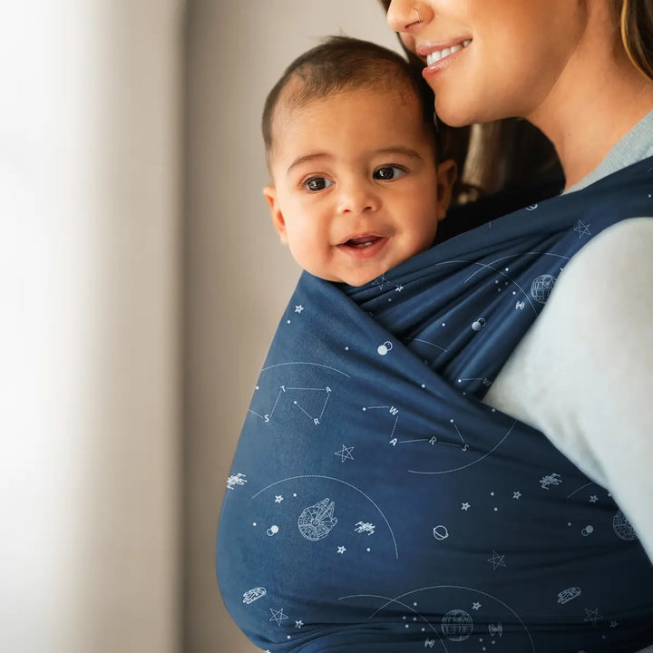 mom wearing baby in Featherknit Wrap in Hyperspace Traffic