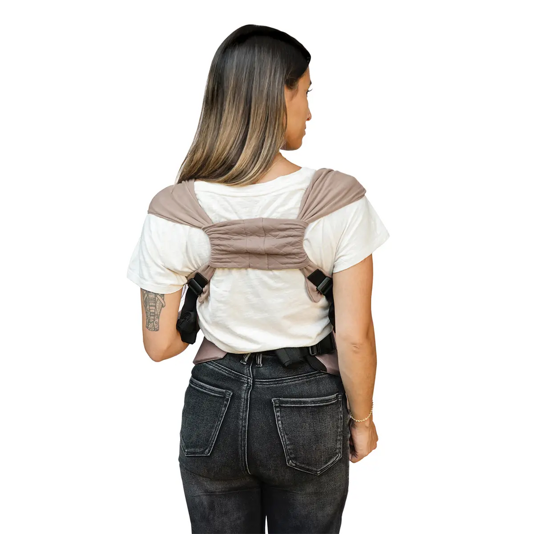 back image of mom wearing the duet carrier in sparrow