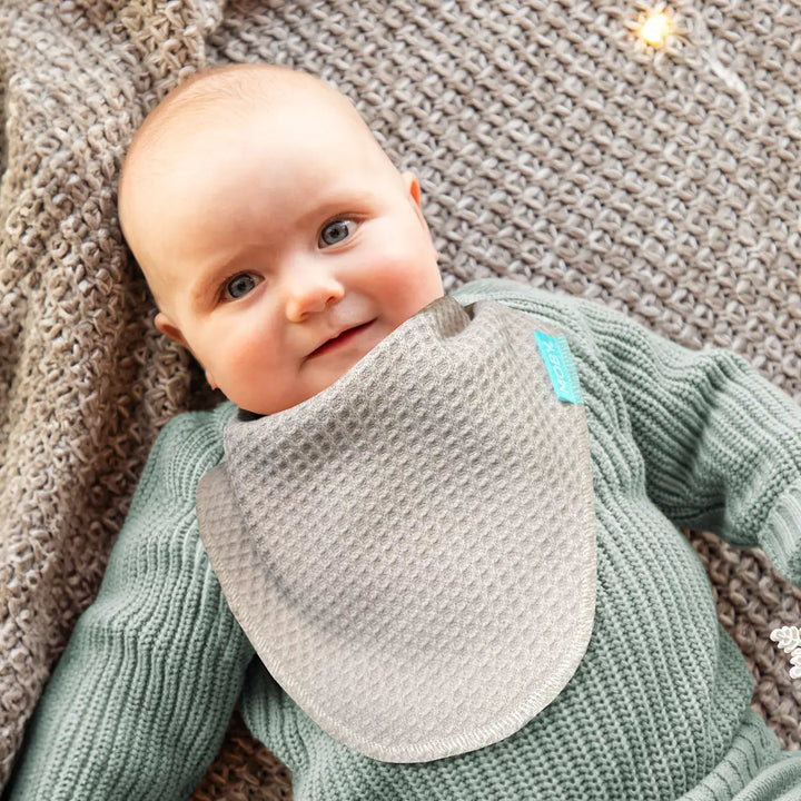 baby wearing waffle knit bib