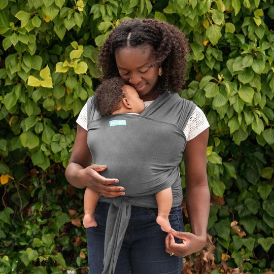 Mom carrying her baby in a moby wrap