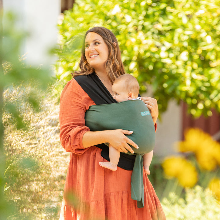 mom wearing baby in easy wrap in olive onyx